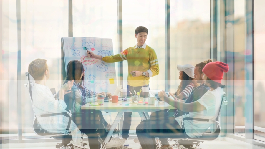 Young professionals collaborating on a content strategy project in a modern office.
